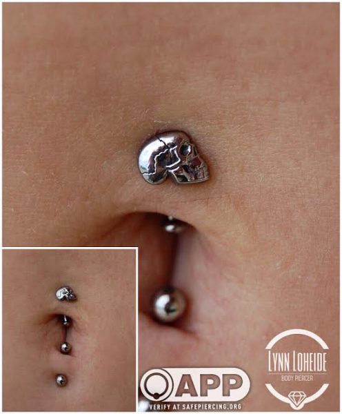 top and bottom navel piercing